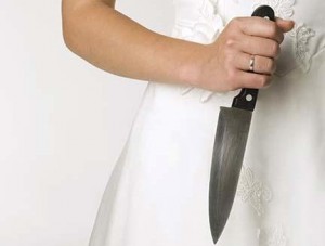 Bride holding knife, close-up