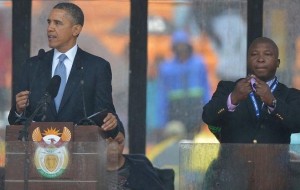 603919-barack-obama-prononce-un-eloge-de-mandela-traduit-par-un-interprete-en-langage-des-signes-a-soweto-l